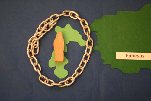 Felt illustration of John imprisoned on the island of Patmos.
