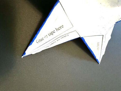 White folded star with words on it