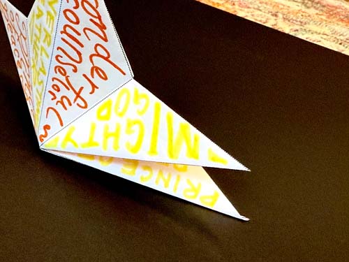 Folding white paper star